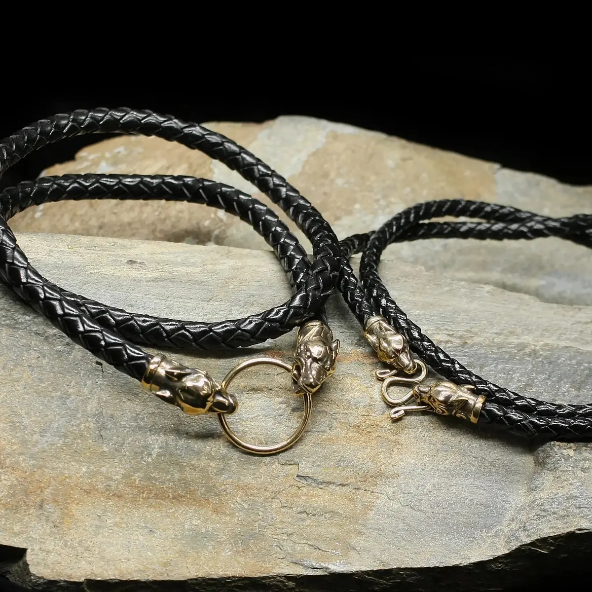 Braided Leather Necklace With Bronze Ferocious Wolf Heads 1