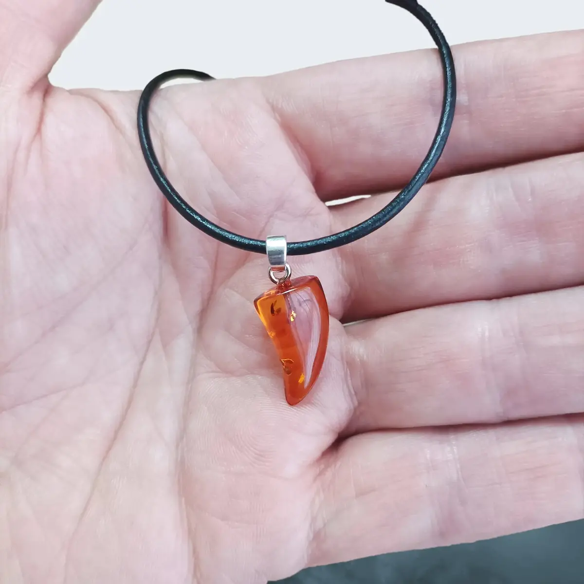 Amber Tooth Pendant With Silver Hanger 1